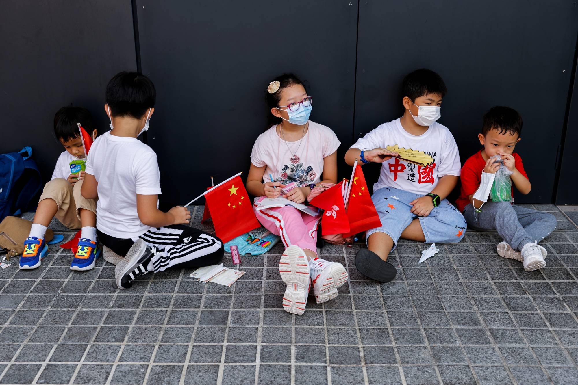 Children attend an event to celebrate Chinese National Day in Hong Kong on Oct. 1. | REUTERS