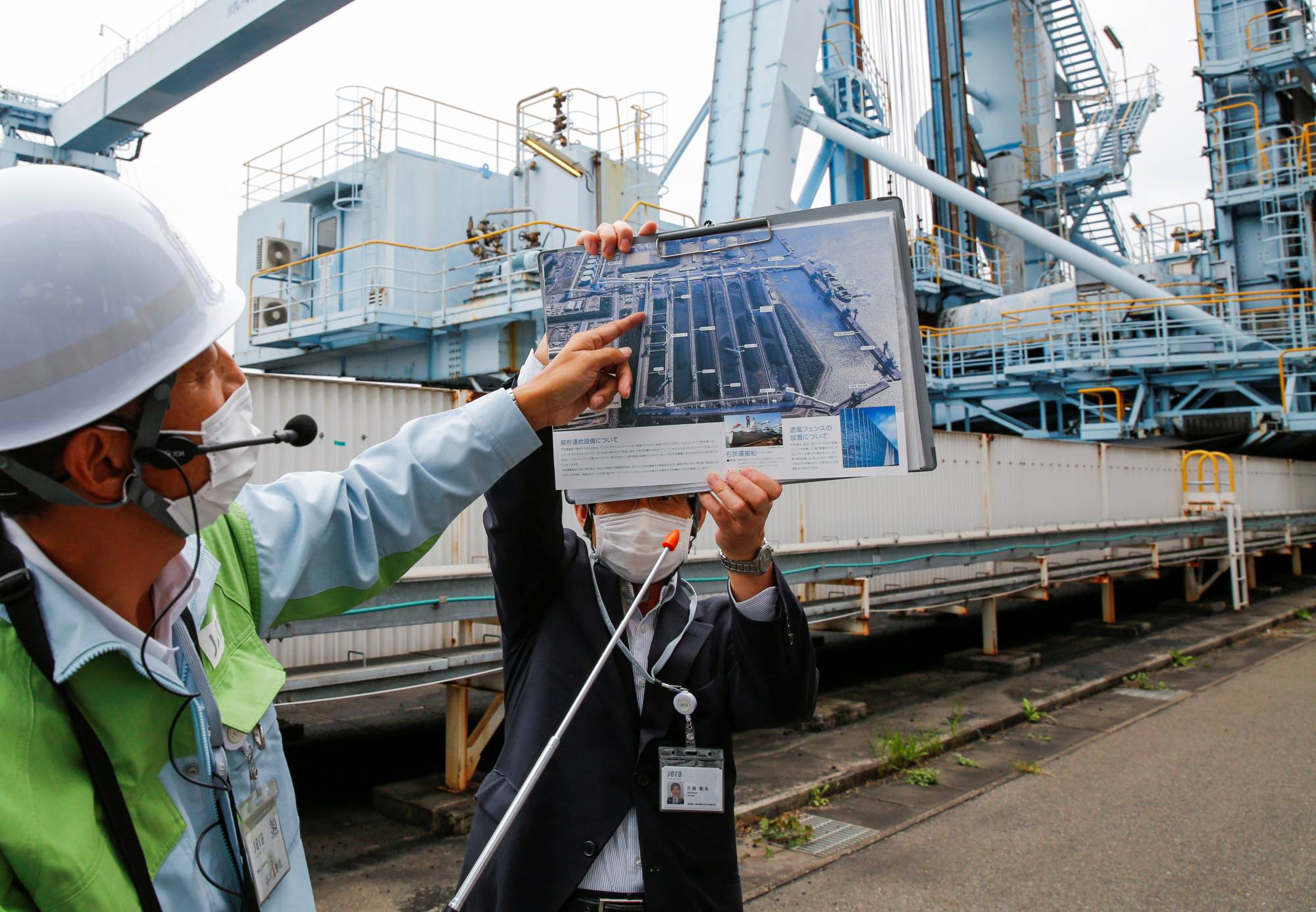 Employees of JERA speak to reporters at JERA's Hekinan thermal power station in Hekinan, Aichi Prefecture. | Reuters 