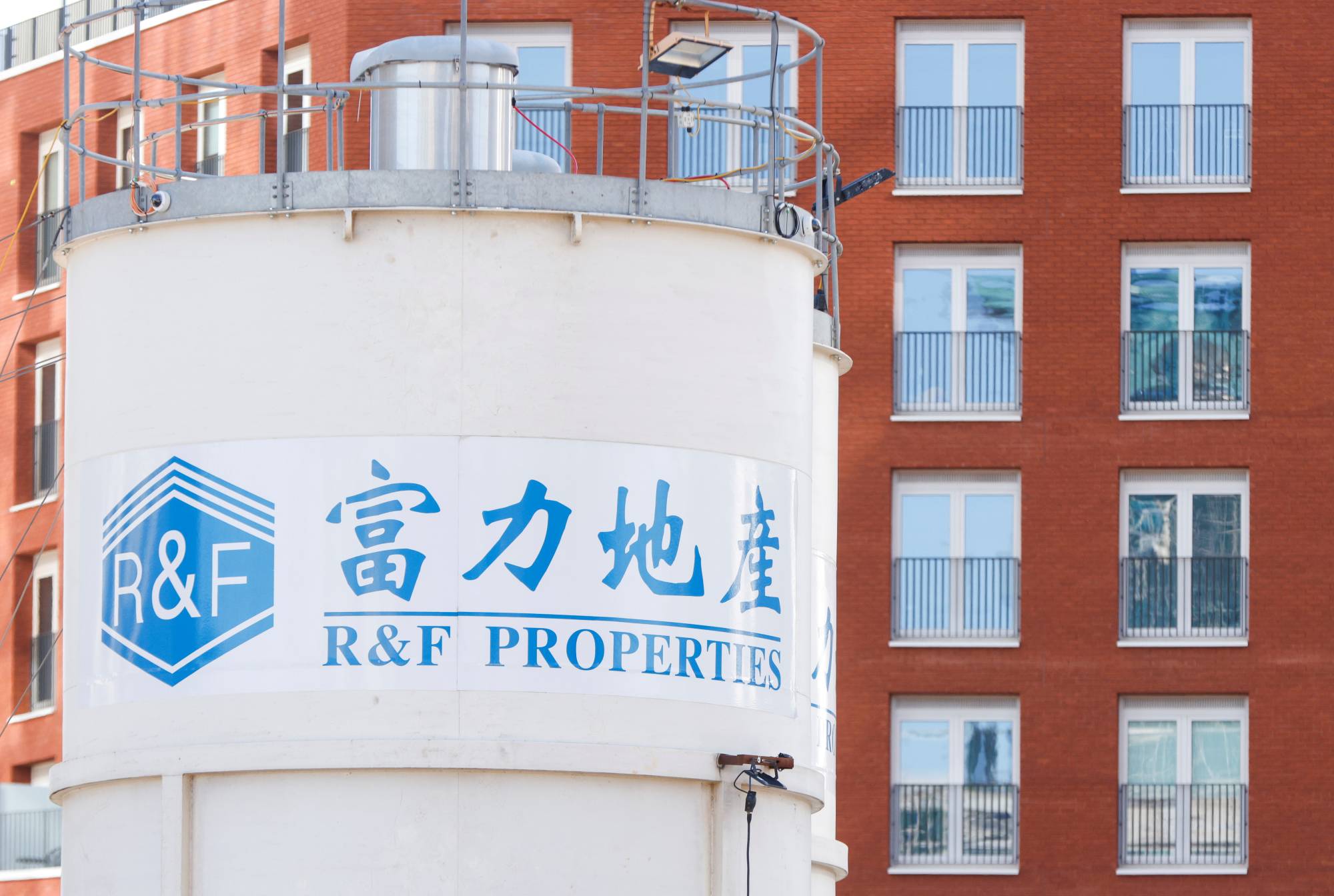 The logo of developer R&F Properties near the One Thames City construction site at Nine Elms, London | REUTERS 