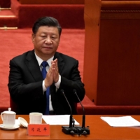 Chinese leader Xi Jinping attends the commemoration of the 110th anniversary of the Xinhai Revolution, which overthrew the Qing Dynasty and led to the founding of the Republic of China, at the Great Hall of the People in Beijing on Oct. 9. | AFP-JIJI