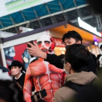 Kazuki Shimauchi, 32, poses for a selfie in Shibuya on Sunday.  | ROB GILHOOLY
