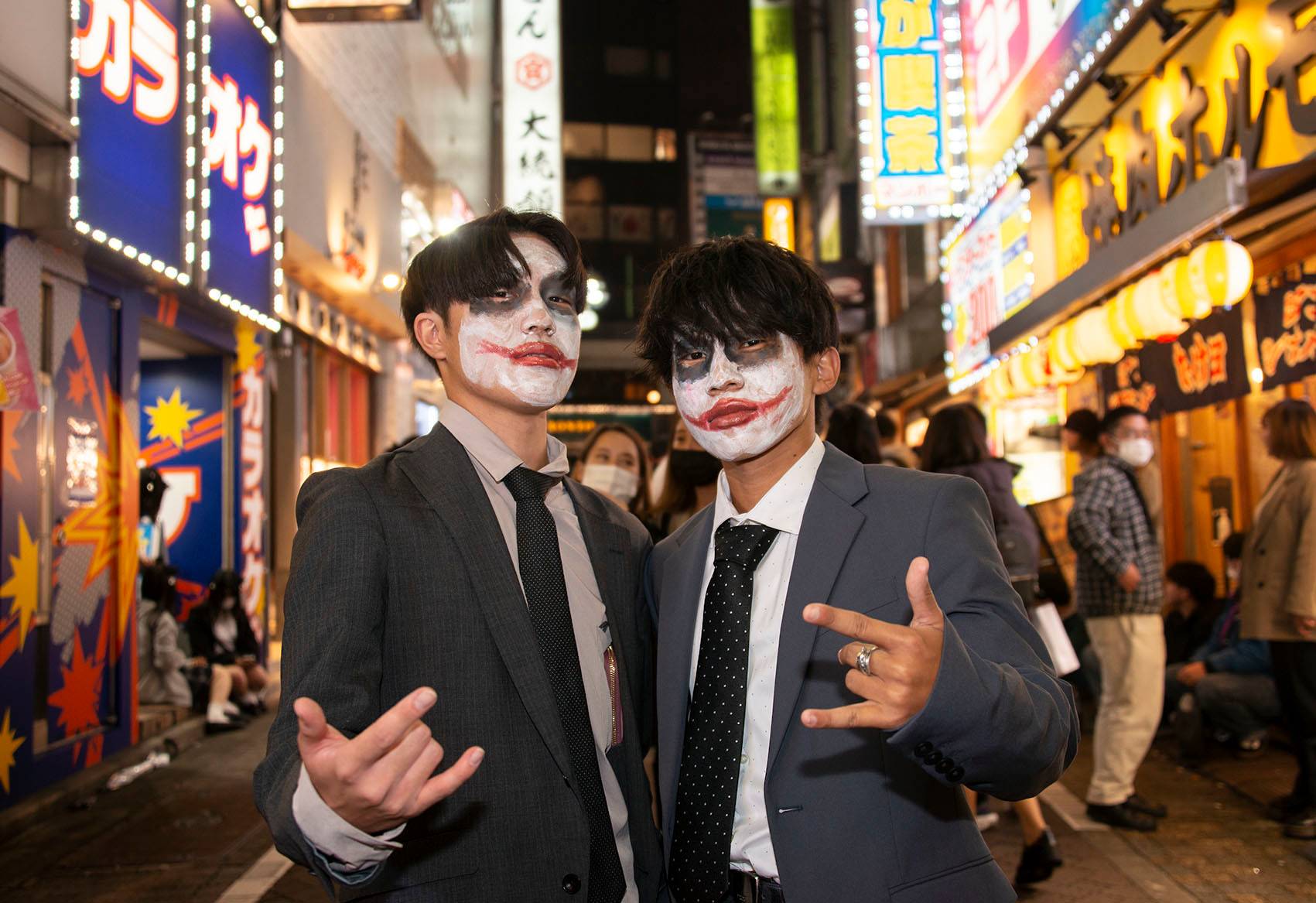 Eito Hoshi (right) and Kodai Mori, both 18, pose for a photo on Sunday. With Japan's voting age having been lowered to 18 five years ago, Mori had decided to visit his local polling station to post a ballot for the first time. 'But, then there was this: my first time to experience Halloween,' he says, adding he borrowed one of his dad’s suits as a sort of comment on salaried workers. 'I am interested in politics and economics, so I wanted to make use of my right to vote. But it’s difficult to relate to Japanese politicians, who are all older, and don't have a clue what younger people are thinking. Politics isn't really presented as something for young people like us. It's the older people who vote, and in the end they are the ones who stand most to gain. I want them to listen to the young people, to give us a say. They could start by allowing online voting. You can manage your finances online, right? I think if we had online voting, you'd see a massive increase in young voters. But perhaps that's not what they want.' | ROB GILHOOLY