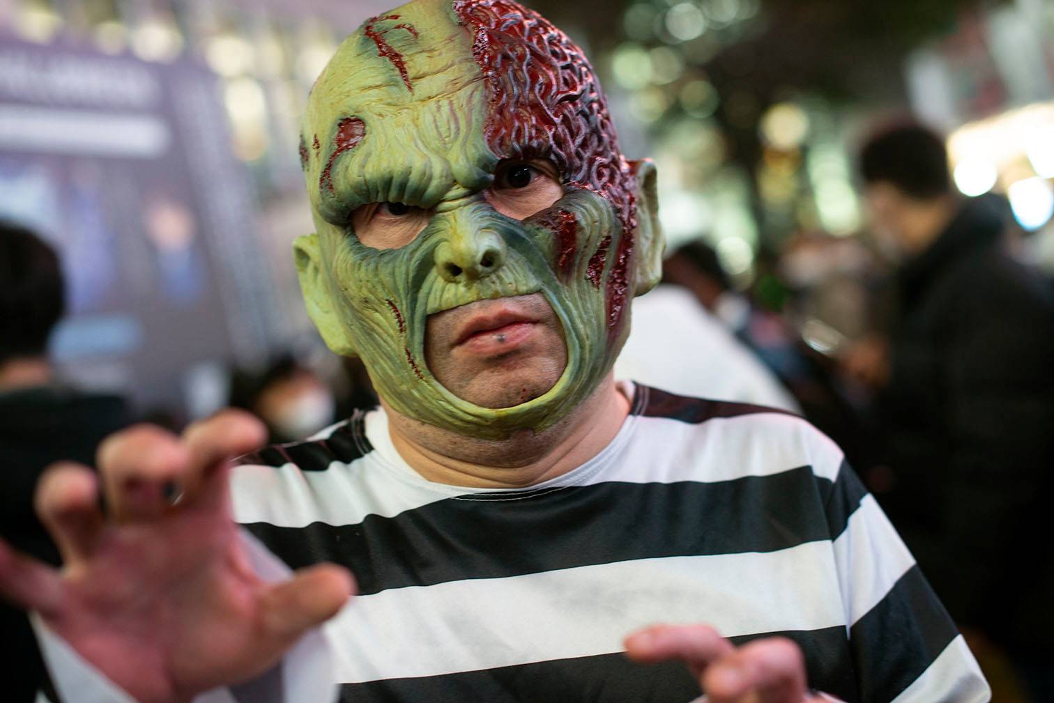 Hirekazu Joda, 40, said he was 'too busy' to go and vote. 'There's little point, anyway, we know the outcome,' he said, while a passerby quipped 'Yeah, we're gonna be ruled by zombies.' | ROB GILHOOLY
