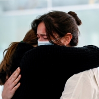 International travelers arrive at Sydney Airport in the wake of COVID-19 border restrictions easing, with fully vaccinated Australians being allowed into Sydney from overseas without quarantine. | REUTERS
