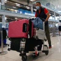 The first group of foreign tourists arrive at Suvarnabhumi Airport in Thailand during the first day of the country\'s reopening campaign, a government plan to jump start the pandemic-hit tourism sector. | REUTERS