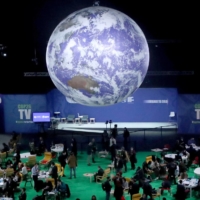 Delegates gather at the COP26 summit on Monday.  | REUTERS 