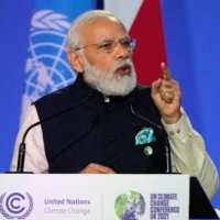 Indian Prime Minister Narendra Modi presents his national statement at the COP26 summit in Glasgow, Scotland, on Monday. | POOL / VIA AFP-JIJI