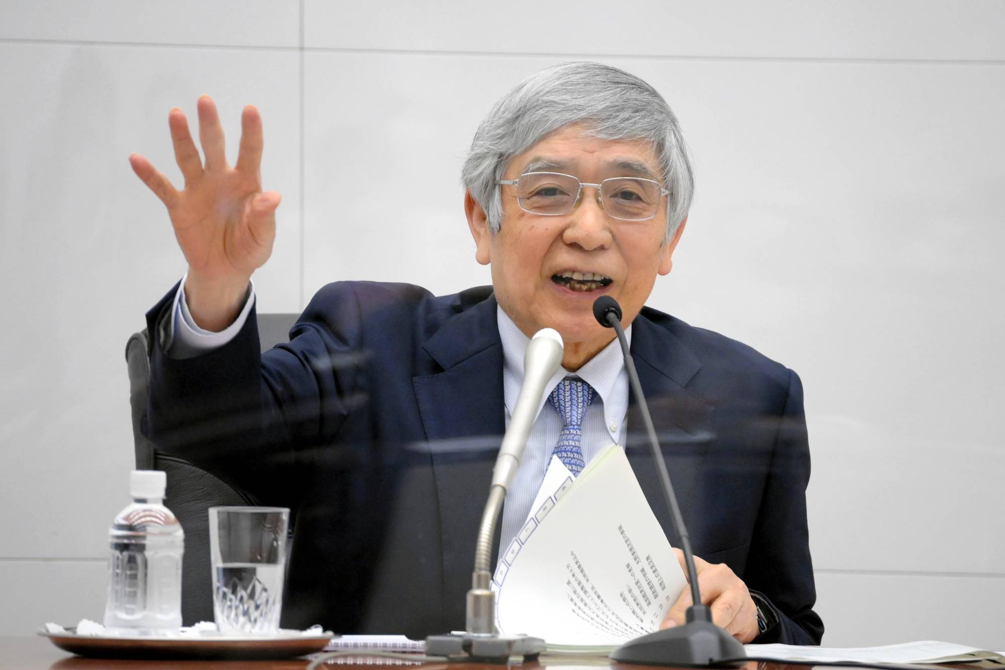 Haruhiko Kuroda, governor of the Bank of Japan (BOJ), speaks during a news conference at the central bank's headquarters in Tokyo last Thursday. | THE ASAHI SHIMBUN / VIA BLOOMBERG