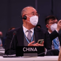 Xie Zhenhua, China\'s special envoy for climate change, attends the COP26 climate talks in Glasgow, Scotland, on Monday. | BLOOMBERG