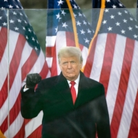 U.S. President Donald Trump speaks to supporters near the White House on Jan. 6, the day of the Capitol riot. Trump’s business brand was once synonymous with wealth and success, an image that now clashes sharply with a political brand rooted in the anger of his largely rural and working-class voter base. | AFP-JIJI