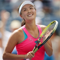 Peng Shuai celebrates after recording a match point against Belinda Bencic on day nine of the U.S. Open tennis tournament in September 2014. | USA TODAY SPORTS / REUTERS / VIA KYODO