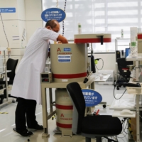 A laboratory technician prepares tests for cesium levels in beef from cattle bred in Fukushima, at Fukushima Agricultural Technology Center in Koriyama on Tuesday. | REUTERS