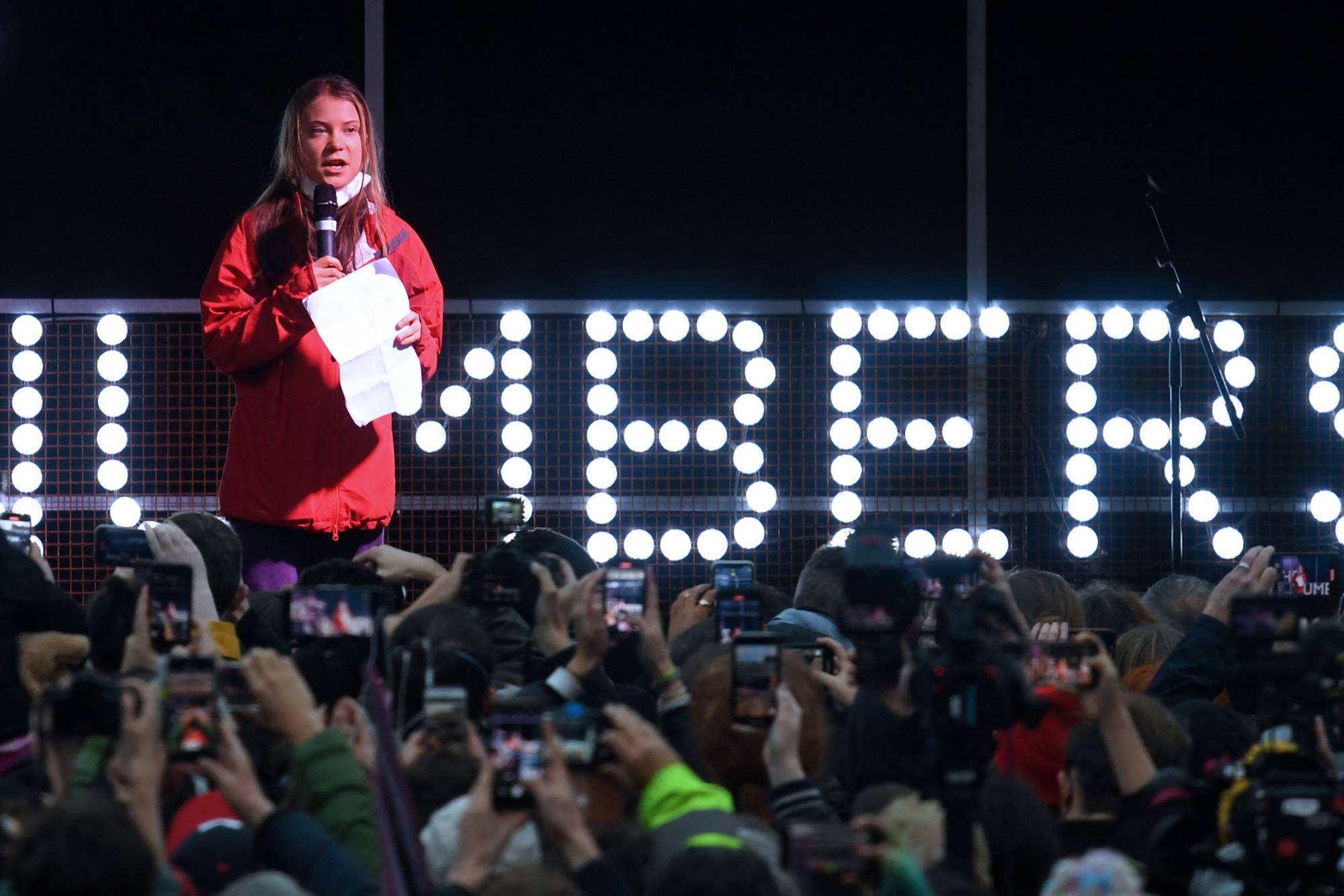 Swedish climate activist Greta Thunberg speaks to the crowd during a rally in Glasgow on Friday. | AFP-Jiji