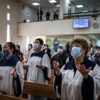 A service at the Presbyterian Christian church, which is run by a South Korean pastor, in Yuzhno-Sakhalinsk, Russia, on Oct. 3 on the island of Sakhalin, on Russia’s eastern edge.  | SERGEY PONOMAREV/THE NEW YORK TIMES