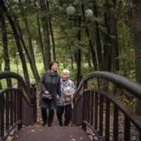 Kim Geum-hee and her mother Taeko Nisio, who will both soon move to South Korea, walk in a park in Yuzhno-Sakhalinsk, Russia, on Oct. 4 on the island of Sakhalin, on Russia’s eastern edge. | SERGEY PONOMAREV/THE NEW YORK TIMES