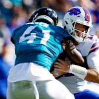 Jaguars linebacker Josh Allen (left) sacks Bills quarterback Josh Allen during the first half of their game in Jacksonville on Sunday. | USA TODAY / VIA REUTERS