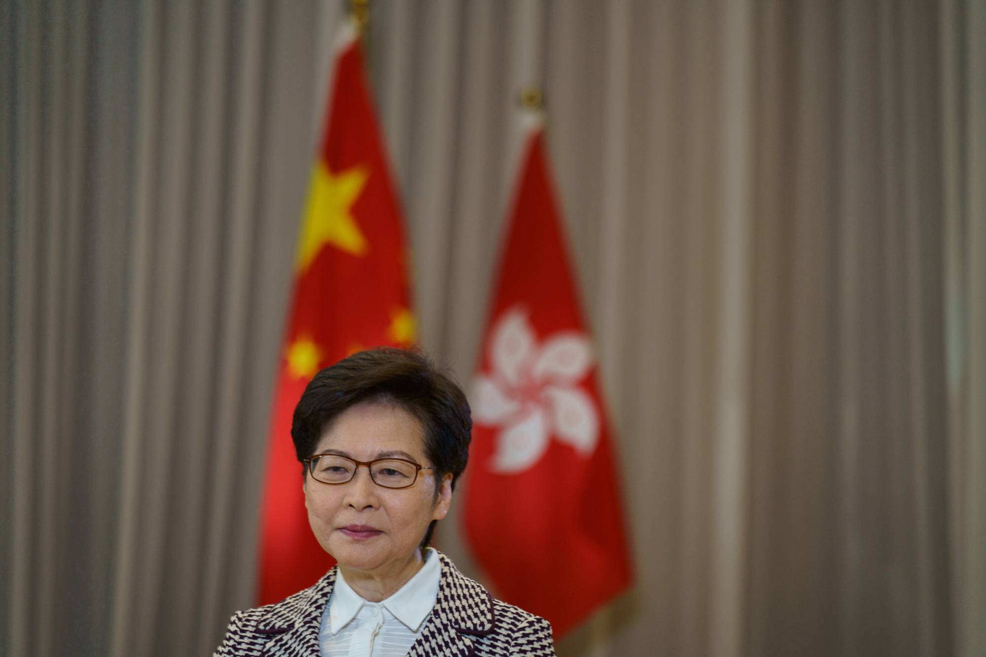 Hong Kong won t open to world until mid 2022 top official says