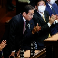 Prime Minister Fumio Kishida is applauded after being re-elected as prime minister by the Lower House in Tokyo on Wednesday.  |  REUTERS