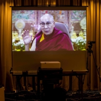 Tibet\'s spiritual leader, the Dalai Lama, speaks online via a video link to a gathering of members of the media at the Foreign Correspondents\' Club of Japan in Tokyo on Wednesday. | AFP-JIJI