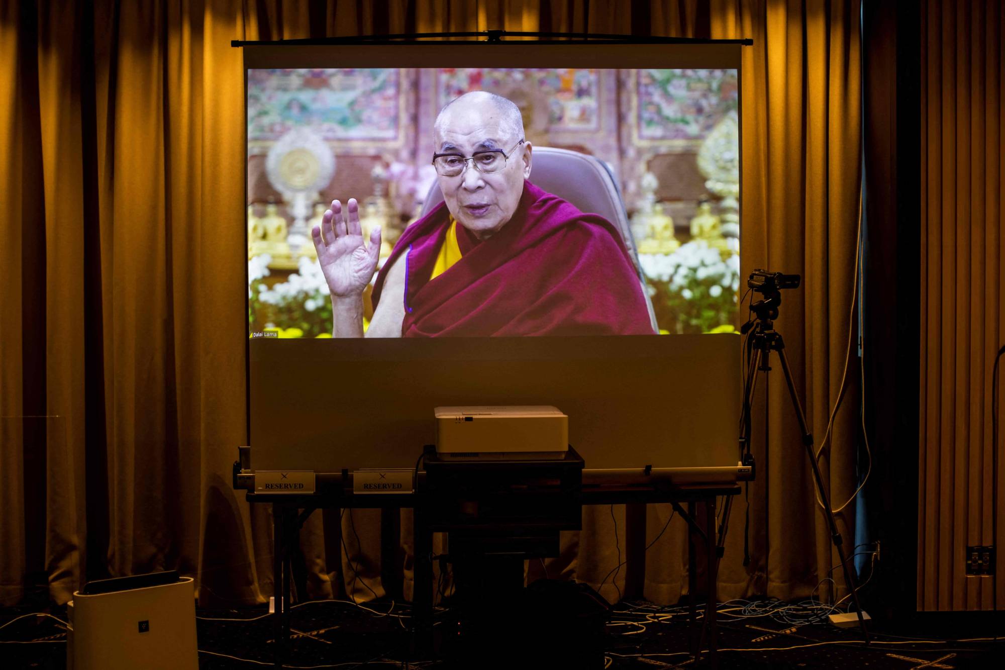 Tibet's spiritual leader, the Dalai Lama, speaks online via a video link to a gathering of members of the media at the Foreign Correspondents' Club of Japan in Tokyo on Wednesday. | AFP-JIJI