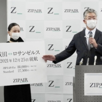 Zipair Tokyo Inc. President Shingo Nishida (right) speaks during a news conference at Narita Airport on Friday. | KYODO