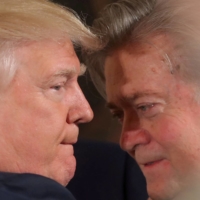 U.S. President Donald Trump talks to chief strategist Steve Bannon during a swearing in ceremony for senior staff at the White House in Washington in January 2017. | REUTERS