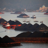 Coal barges line up in the Mahakam river in Samarinda, East Kalimantan province, Indonesia. | REUTERS 