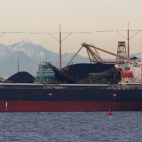 Bulk carriers are filled with coal for export at Roberts Bank Superport in Delta, British Columbia, Canada. | REUTERS 
