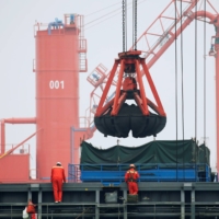 Coal is loaded into a bulk carrier at Qingdao Port, Shandong province, China. | REUTERS 