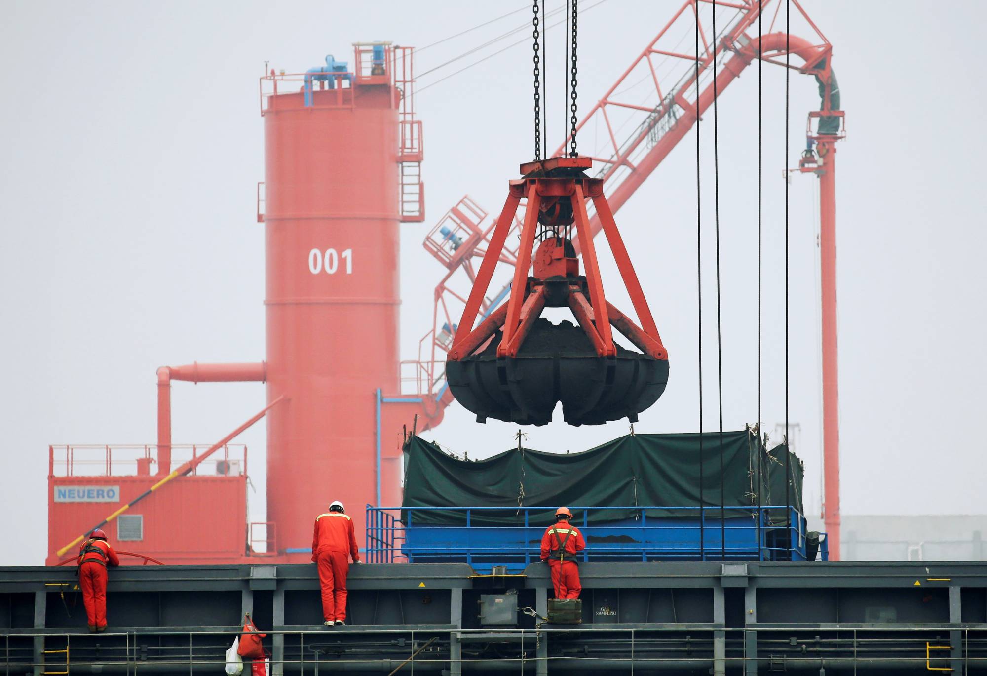 Coal is loaded into a bulk carrier at Qingdao Port, Shandong province, China. | Reuters 