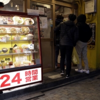 Takayuki Tsuruga, an economist and professor at Osaka University, says a number of factors are dampening inflation expectations despite a post-COVID-19 consumption rebound firms are hoping for. | BLOOMBERG