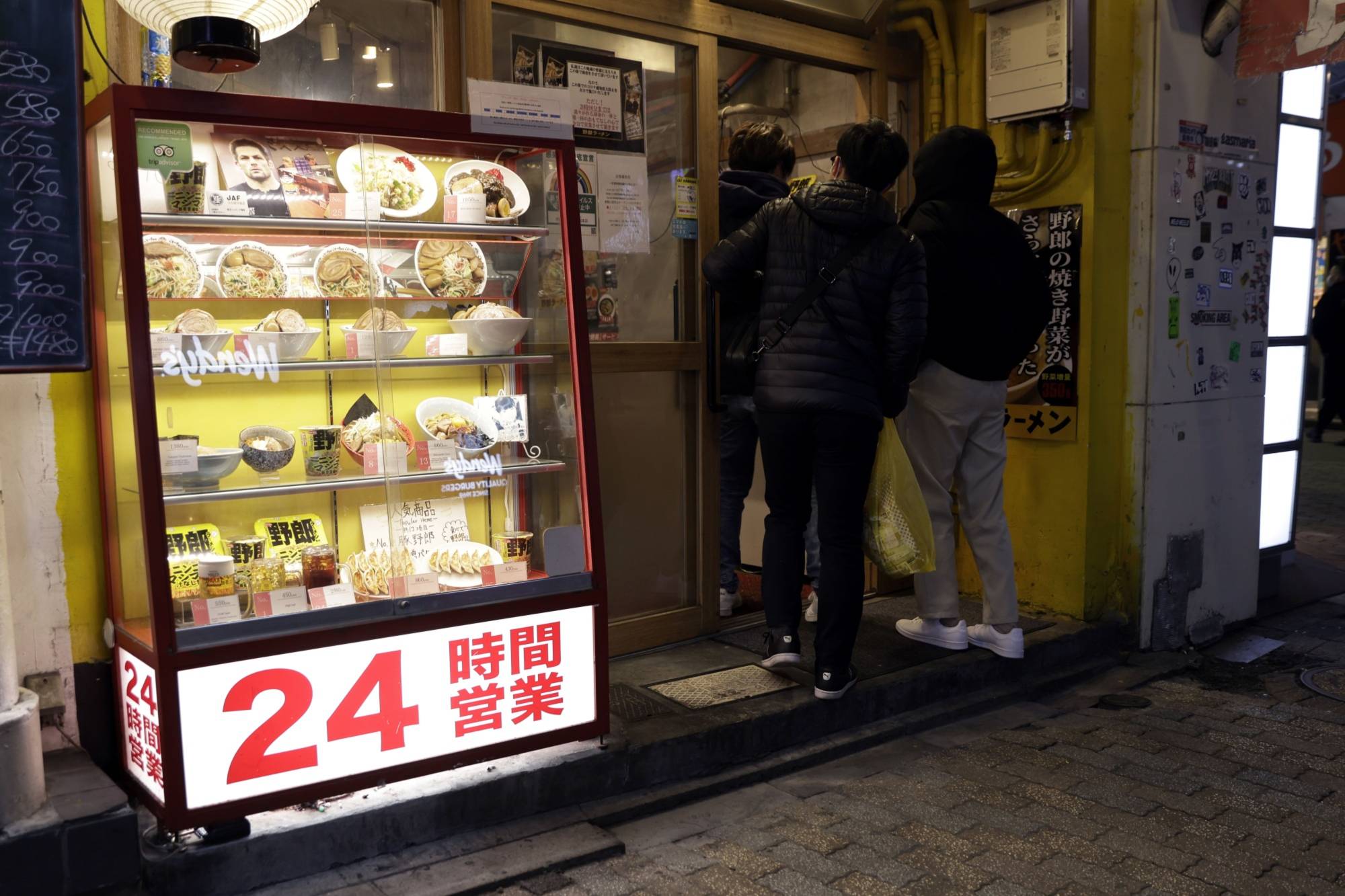Takayuki Tsuruga, an economist and professor at Osaka University, says a number of factors are dampening inflation expectations despite a post-COVID-19 consumption rebound firms are hoping for. | BLOOMBERG