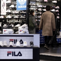 Takayuki Tsuruga, an economist and professor at Osaka University, says a number of factors are dampening inflation expectations despite a post-COVID-19 consumption rebound firms are hoping for.  | BLOOMBERG