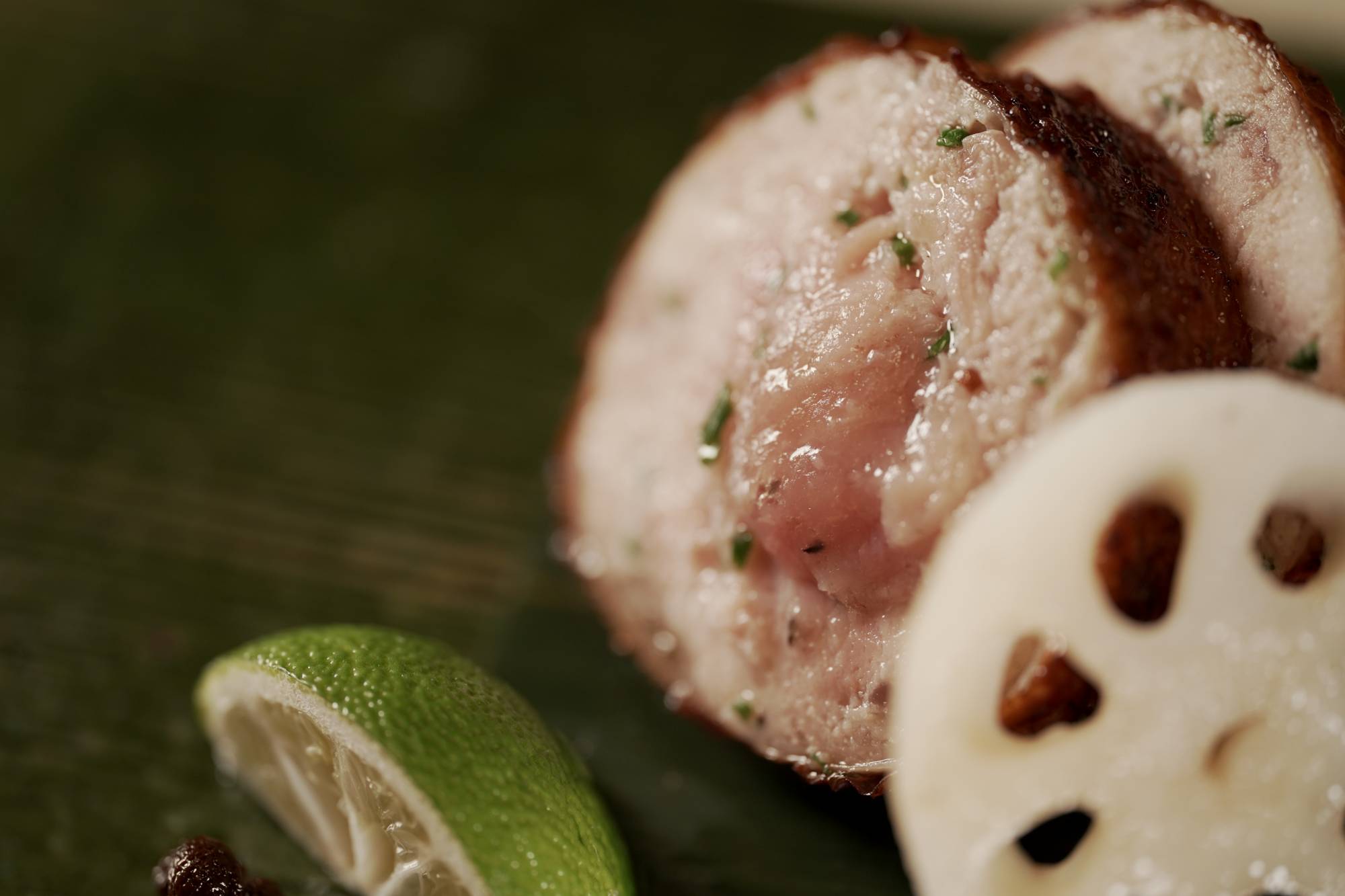 A specialty at Nihonryori Takamura is grilled 'sausage' stuffed with the meat and innards of local 'hinai jidori' chicken. | NAOH INC. 