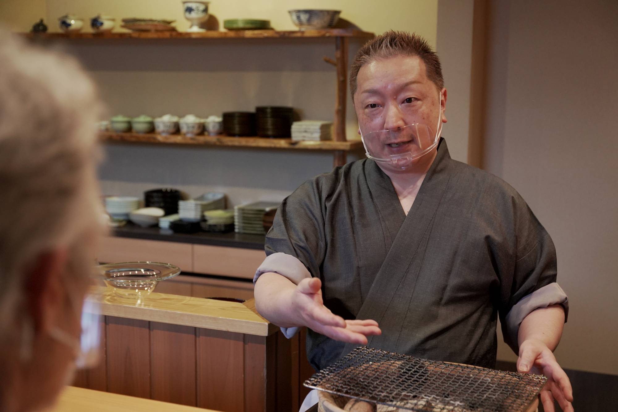 Chef Hiroki Takamura likes to interact with customers while working on his portable 'mizu konro' grill. | NAOH INC. 