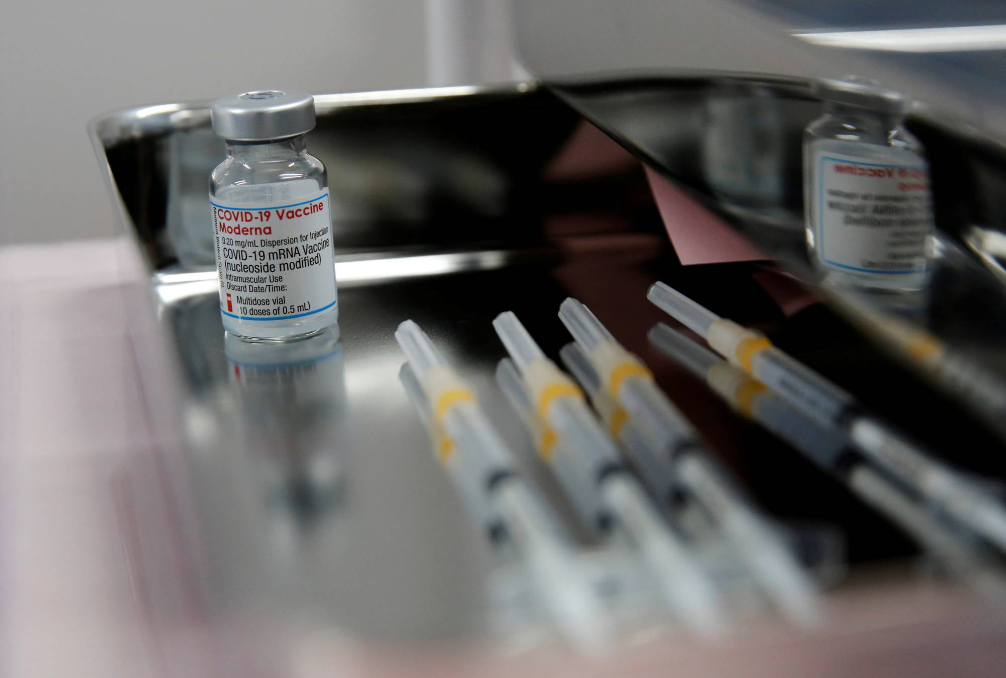 A vial of the Moderna vaccine at Haneda Airport in June | REUTERS