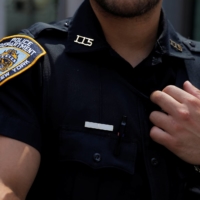 An officer from the New York City Police Department (NYPD) stands in Times Square in Manhattan, New York City on Aug 19. | REUTERS