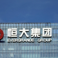 One of Asia’s oldest hedge funds, LIM Advisors, is picking up distressed bonds of Chinese developers even as the fallout from China Evergrande Group deepens. | REUTERS