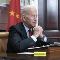 U.S. President Joe Biden listens during a virtual meeting with Chinese leader Xi Jinping at the White House in Washington on Monday.  | UPI / VIA BLOOMBERG 