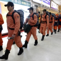 A Taiwanese earthquake search and rescue team prepares to depart Taipei\'s Songshan Airport for Japan to help find survivors after the Great East Japan Earthquake in March 2011. | REUTERS