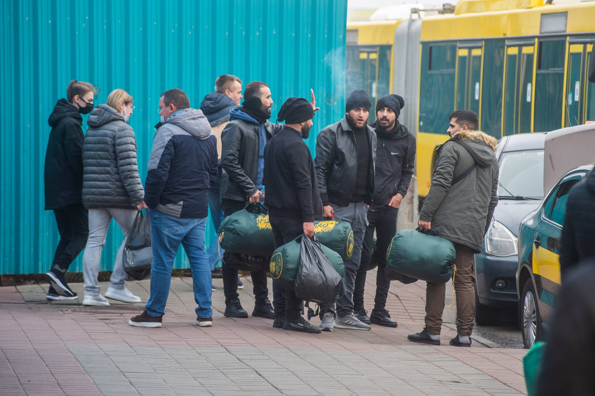 Migrants congregate at a market in Minsk on Saturday. Iraqi Kurds and other migrants said they were fleeing despair at home, but Belarus encouraged them to come, offering visas and helping them get to the border with other European countries.  | THE NEW YORK TIMES