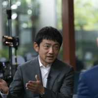 Yuzo Kano, chief executive officer of bitFlyer Inc., speaks during a Bloomberg Television interview in Singapore on Thursday. | BLOOMBERG