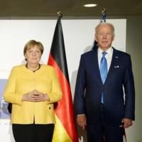 U.K. Prime Minister Boris Johnson, French President Emmanuel Macron, German Chancellor Angela Merkel and U.S. President Joe Biden pose for a  photo during their meeting to discuss Iran\'s nuclear program, on the sidelines of the Group of 20 leaders\' summit in Rome in October.  | REUTERS 