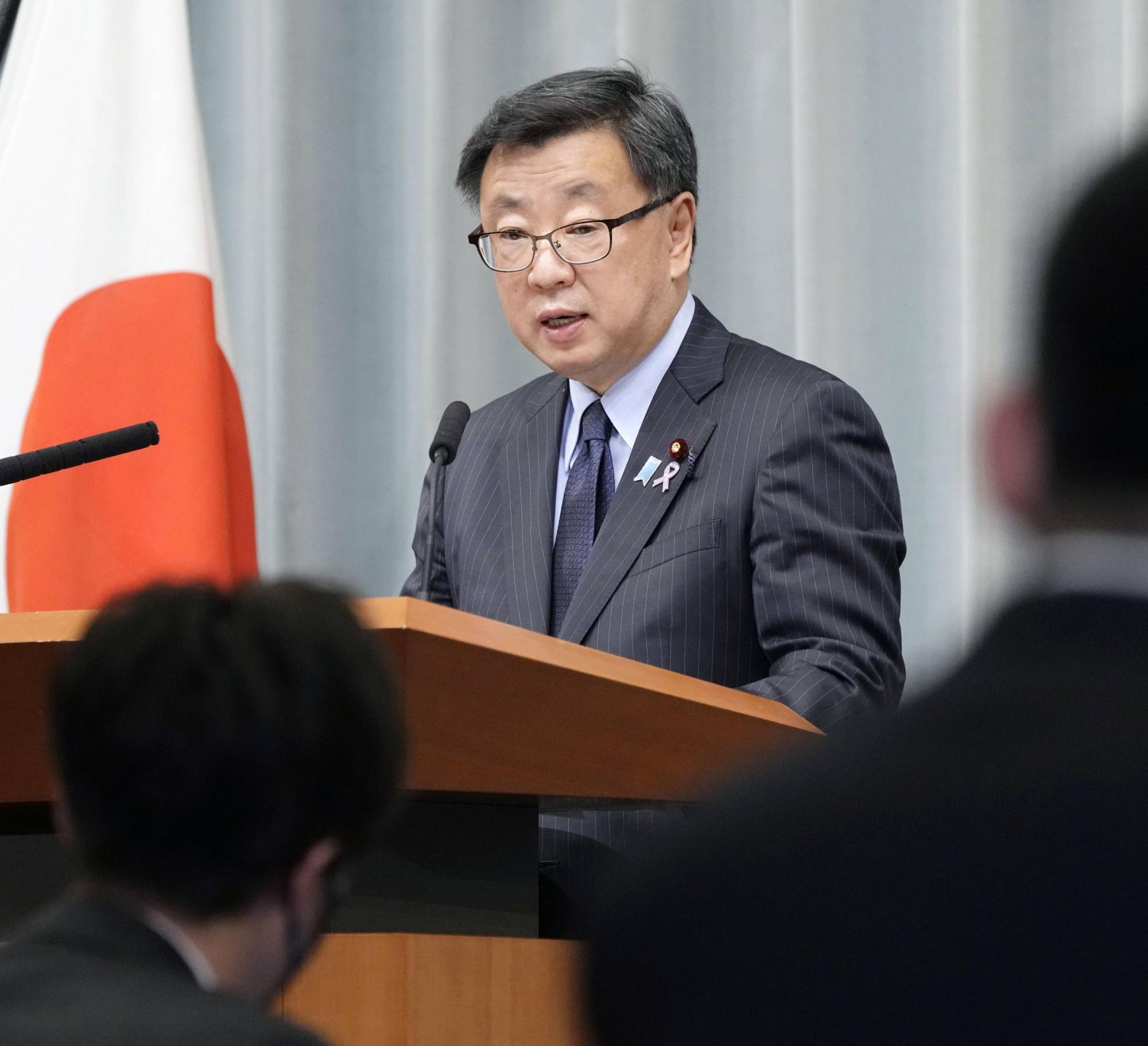 Chief Cabinet Secretary Hirokazu Matsuno, the government's top spokesman, speaks during a news conference at the Prime Minister's Office in Tokyo on Friday. | KYODO