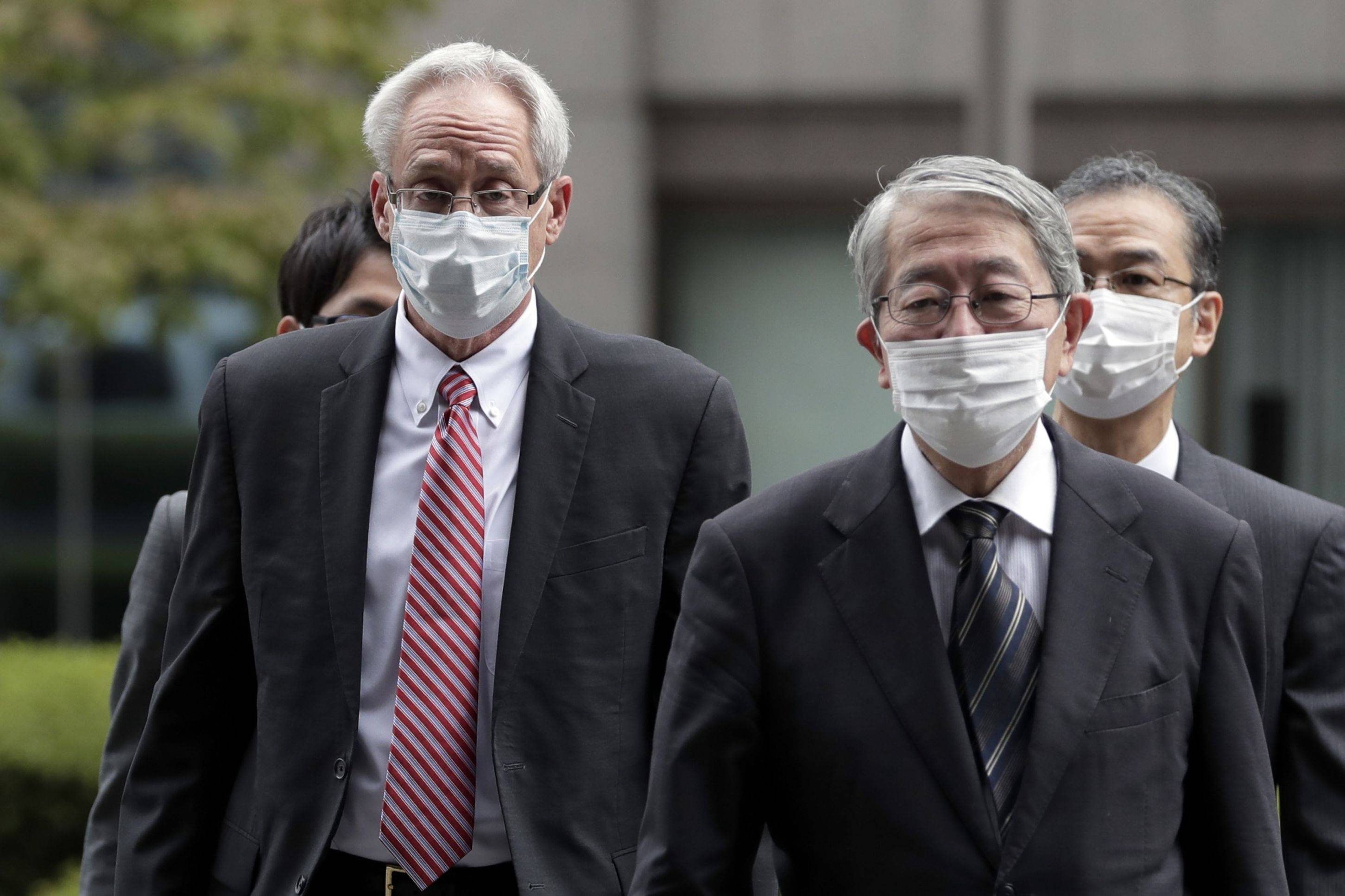 Greg Kelly (left), former representative director of Nissan Motor Co., arrives at the Tokyo District Court in September 2020. | BLOOMBERG