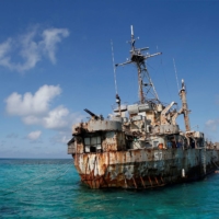 The Sierra Madre, a marooned transport ship that Philippine Marines live on as a military outpost, is pictured in the disputed Second Thomas Shoal, part of the Spratly Islands in the South China Sea, in March 2014.   | REUTERS