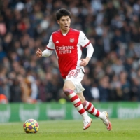 Arsenal defender Takehiro Tomiyasu controls the ball during the team\'s Premier League game against Newcastle United in London on Saturday. | AFP-JIJI