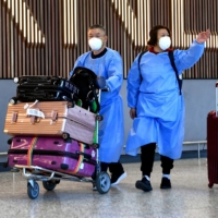 International travelers arrive at Melbourne\'s Tullamarine Airport on Monday.  | AFP-JIJI