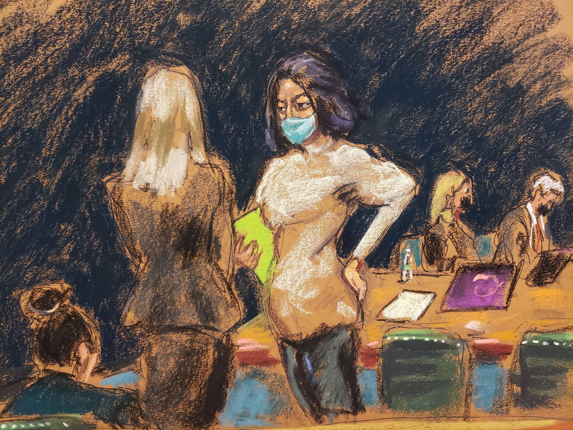 Ghislaine Maxwell talks with her attorneys during her trial on charges of sex trafficking, in a courtroom sketch in New York City, U.S., November 30, 2021. | Reuters
