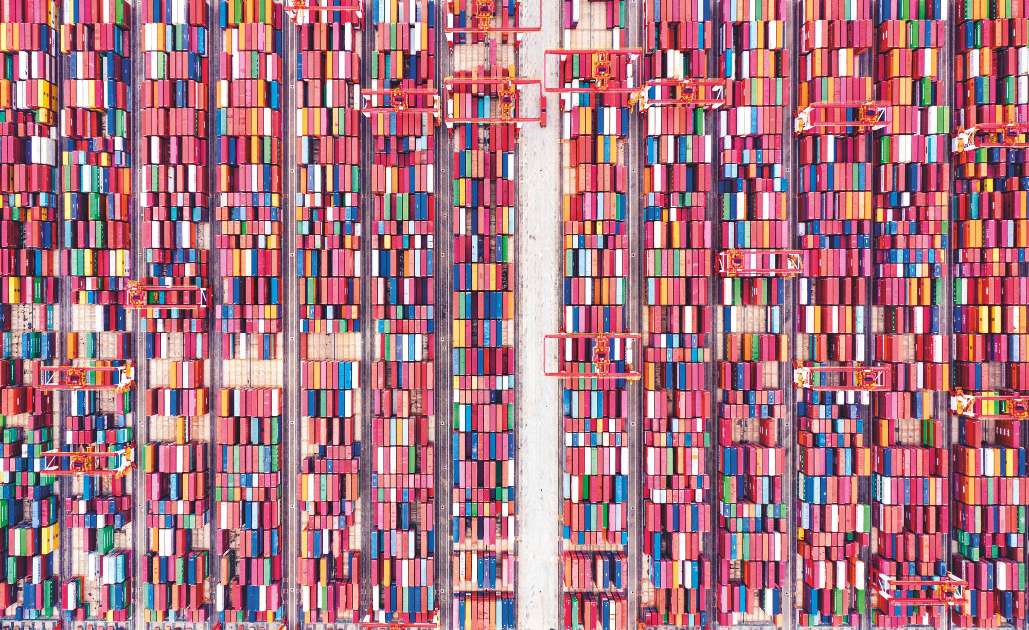 An aerial view of shipping containers sitting stacked at the world's biggest automated container terminal in Shanghai, China, in May 2021. | VCG / VCG / via Getty Images